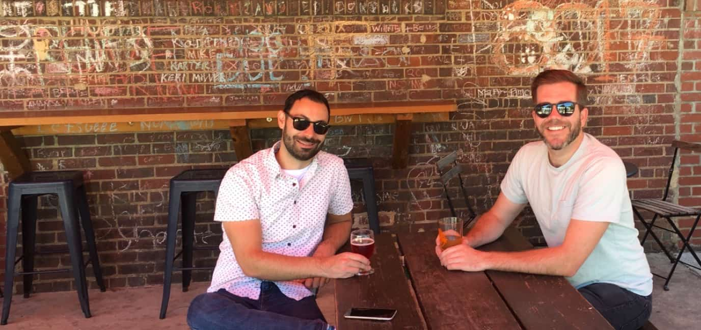 Dan & Tom having a beer on a patio.